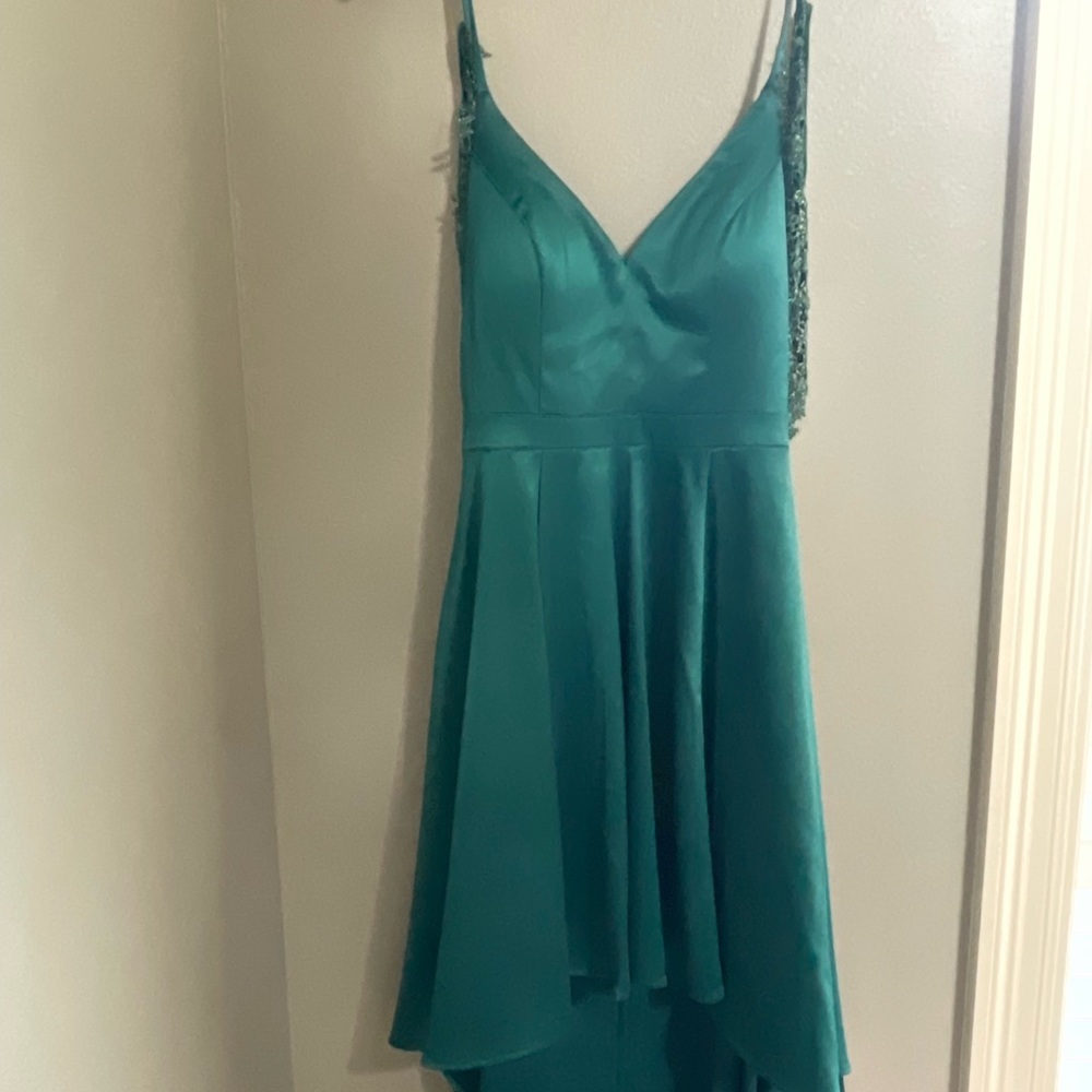 Size 5. Green beautiful Sequin Hearts dress. Wore once to homecoming.
